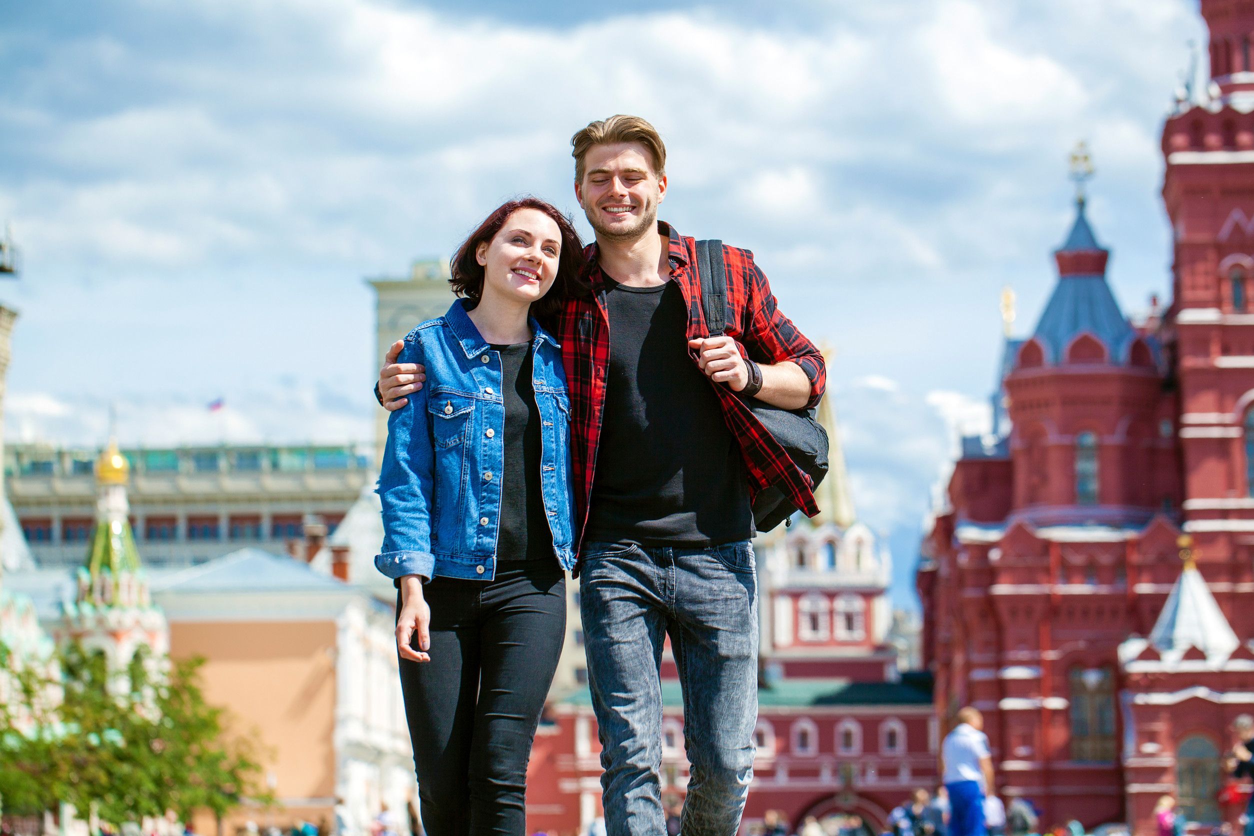 Happy tourists sightseeing city red square Moscow Russia