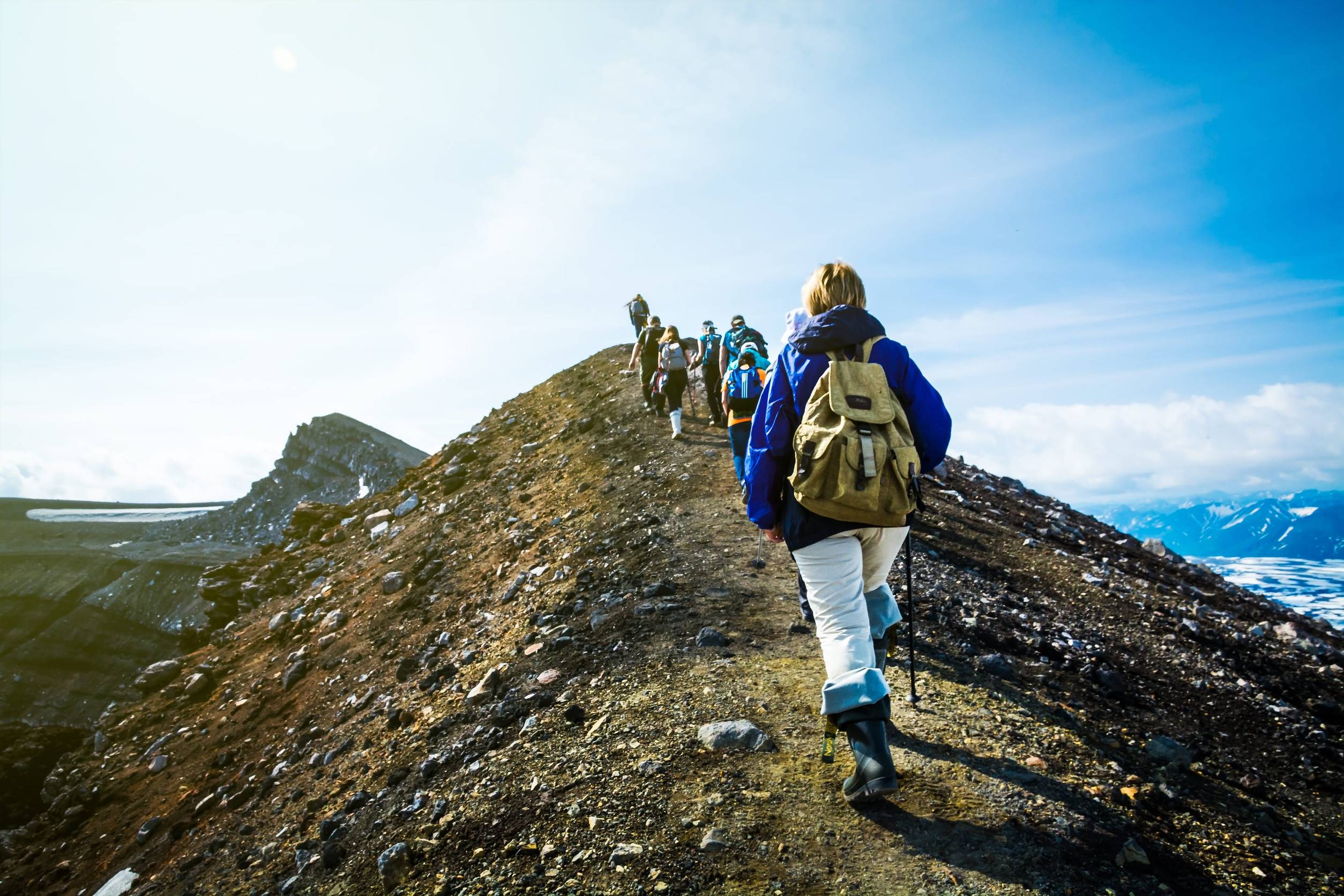 Hikers going up a hill in the Kamchatka region of Russia