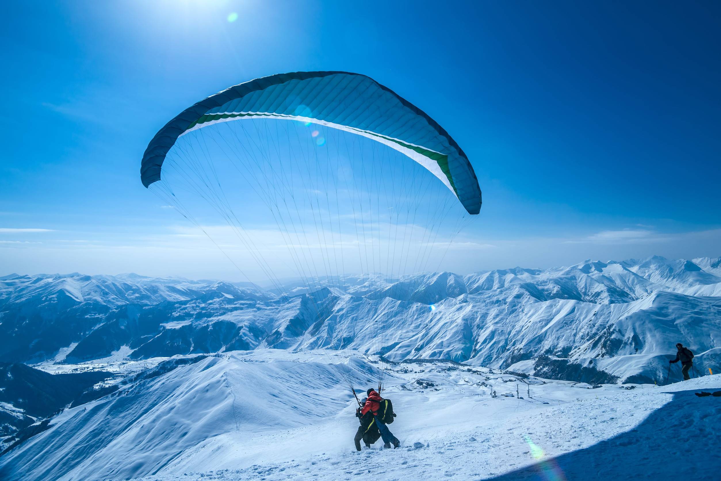 Paragliding in the snowy Caucasus mountains