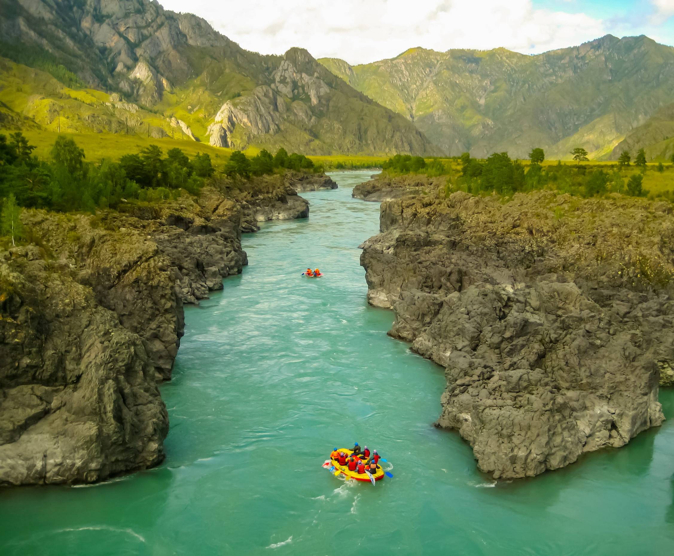 River Rafting between massive canyons in Russia
